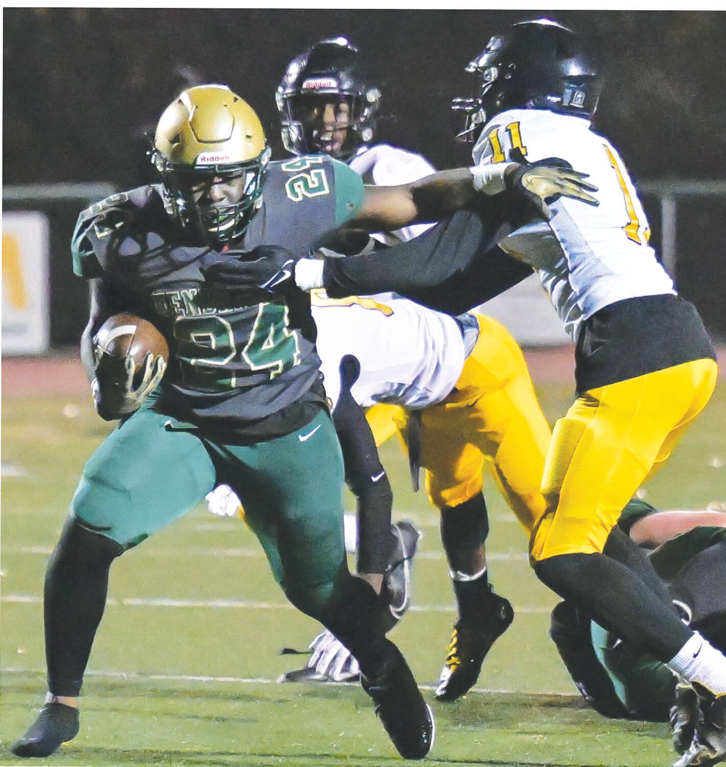 RUNNING AWAY WITH IT: Hendricken’s Ronjai Francis stiff arms a defender.